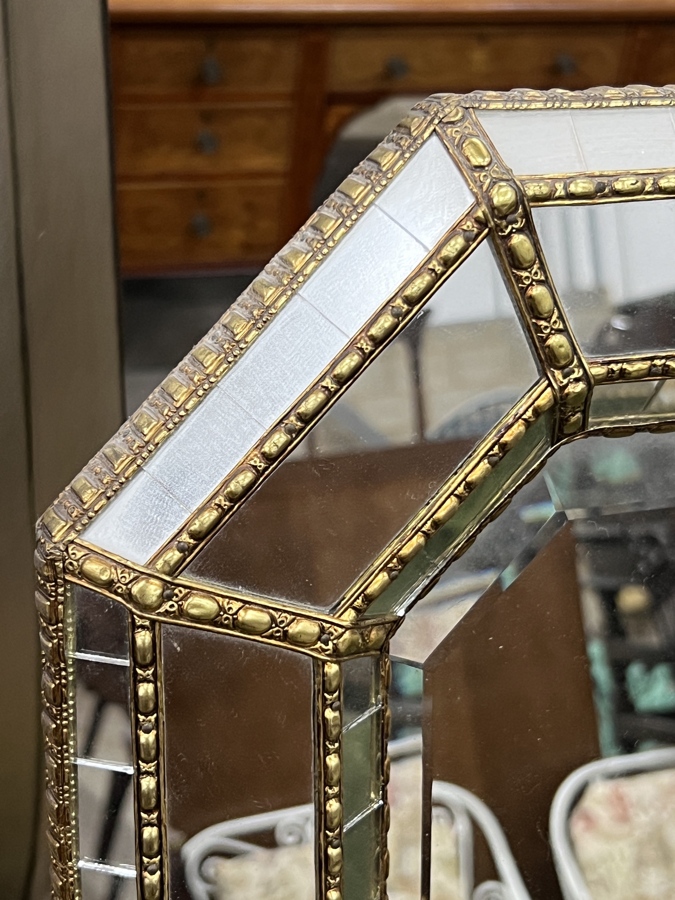 A Venetian style octagonal gilt metal mounted wall mirror, width 106cm, height 75cm